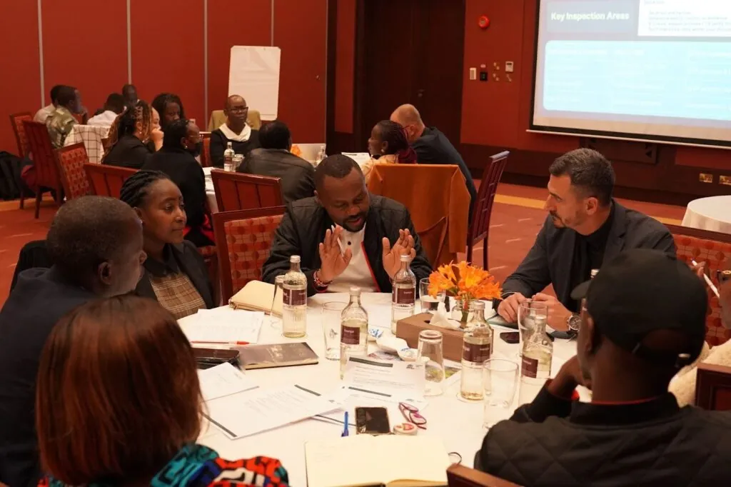 Participants and practitioners discussing an inspection exercise in Naivasha